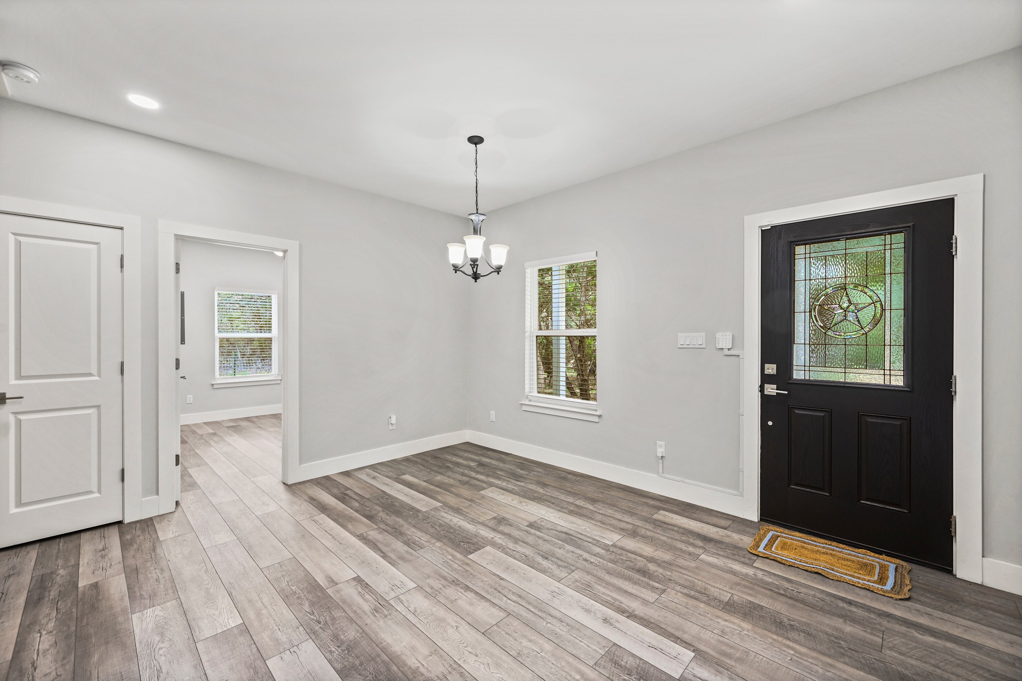 231 North Rainbow Ranch Road Wimberley, TX 78676 - Photo 6 of 40 A welcoming entryway with durable flooring extends an inviting ambiance throughout the home.