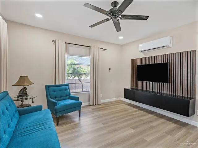 a bedroom with furniture and a window