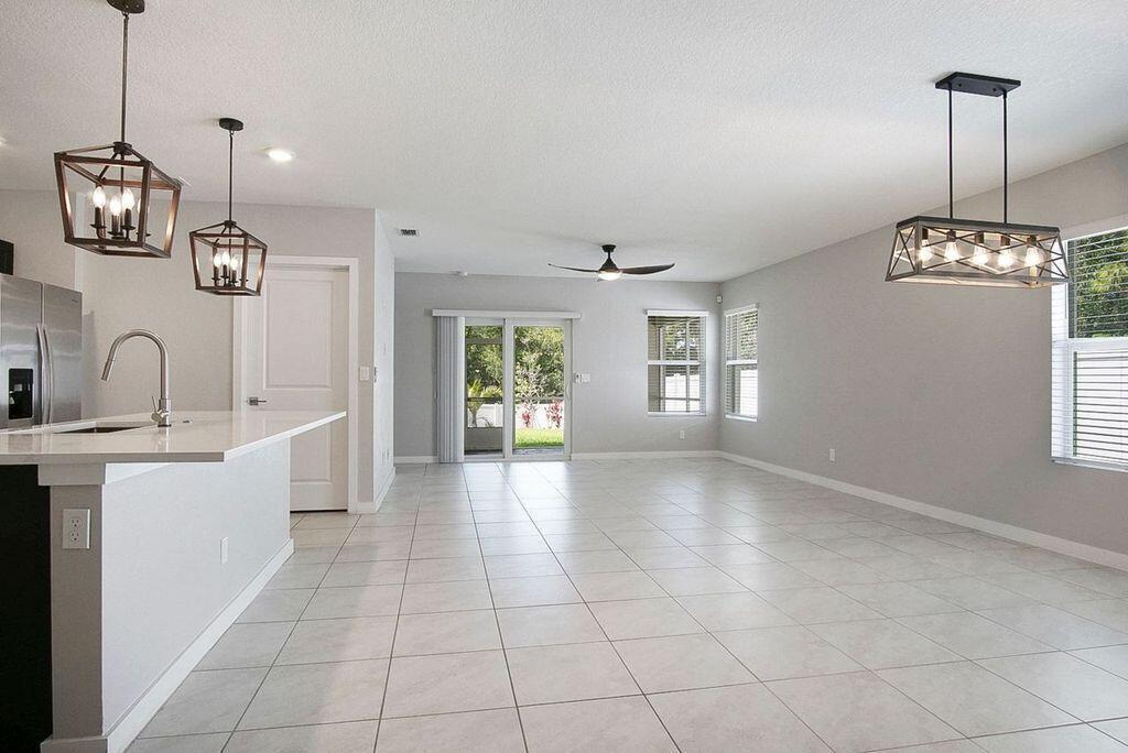 3909 Southeast Lee Street Stuart, FL 34997 - Photo 7 of 19 Dining-living view out to the back yard