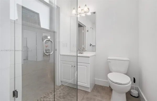 a bathroom with a sink a toilet and vanity