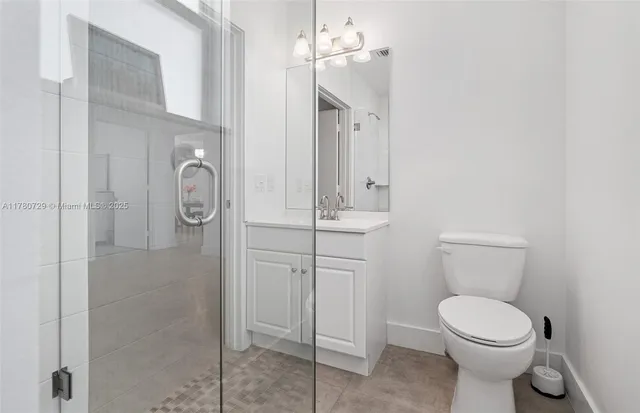 a bathroom with a sink a toilet and vanity