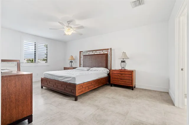 a view of a dining room with furniture and a chandelier