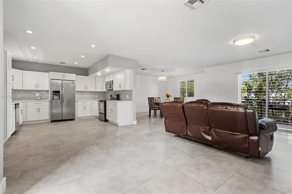 a view of a dining room with furniture window and outside view