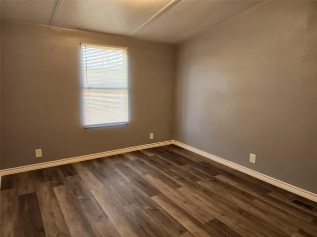 a bathroom with a toilet sink and shower