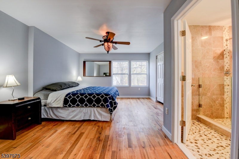 105 Battlehill Avenue Springfield, NJ 07081 - Photo 15 of 22 a bedroom with a bed and a window