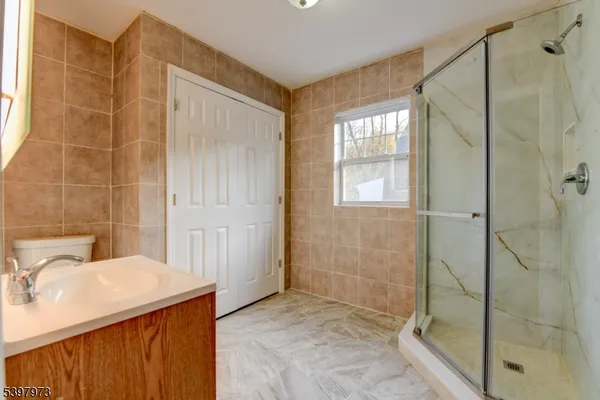 a bathroom with a sink and shower