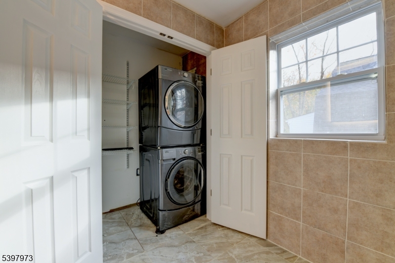 105 Battlehill Avenue Springfield, NJ 07081 - Photo 18 of 22 a utility room with dryer and washer