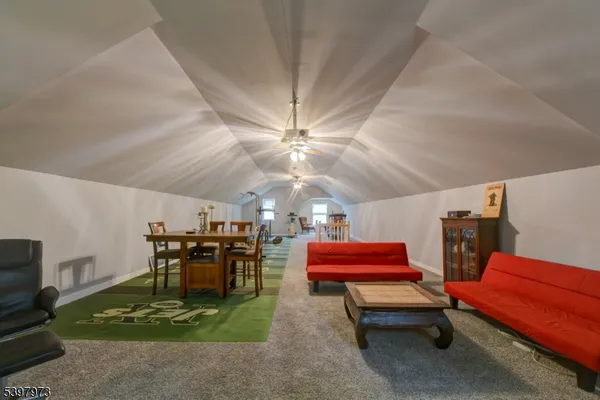 a reading room with furniture and a pool table