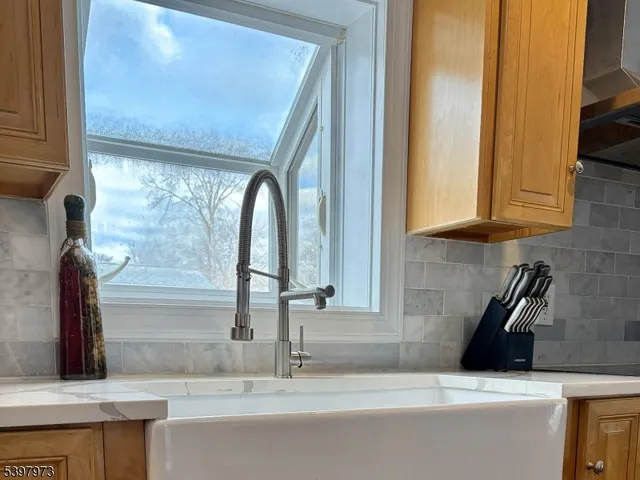 a kitchen with a sink and a window