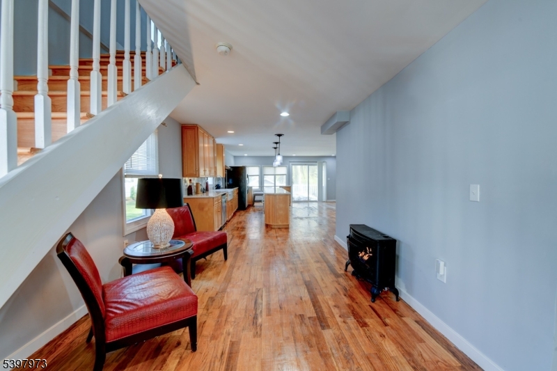 105 Battlehill Avenue Springfield, NJ 07081 - Photo 8 of 22 a living room with furniture and a wooden floor