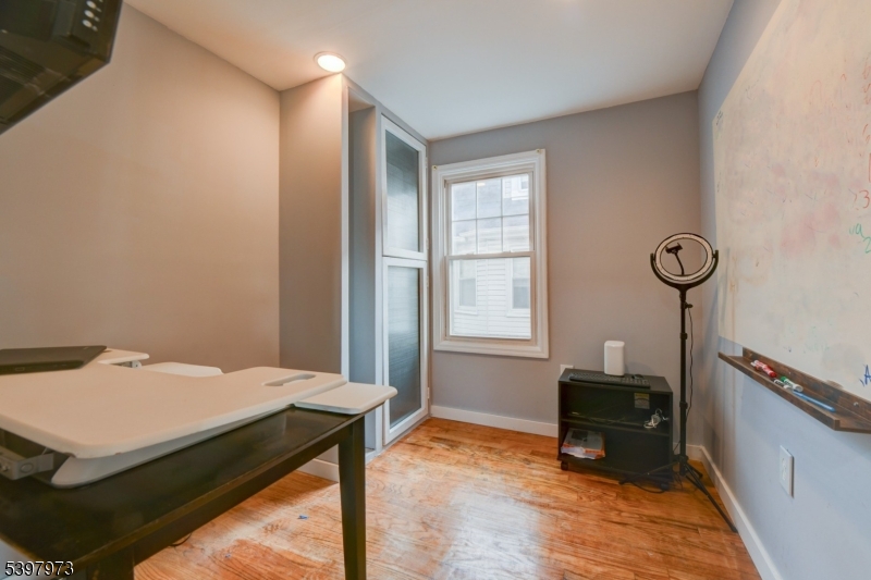 105 Battlehill Avenue Springfield, NJ 07081 - Photo 10 of 22 a bed room with a bed and a window