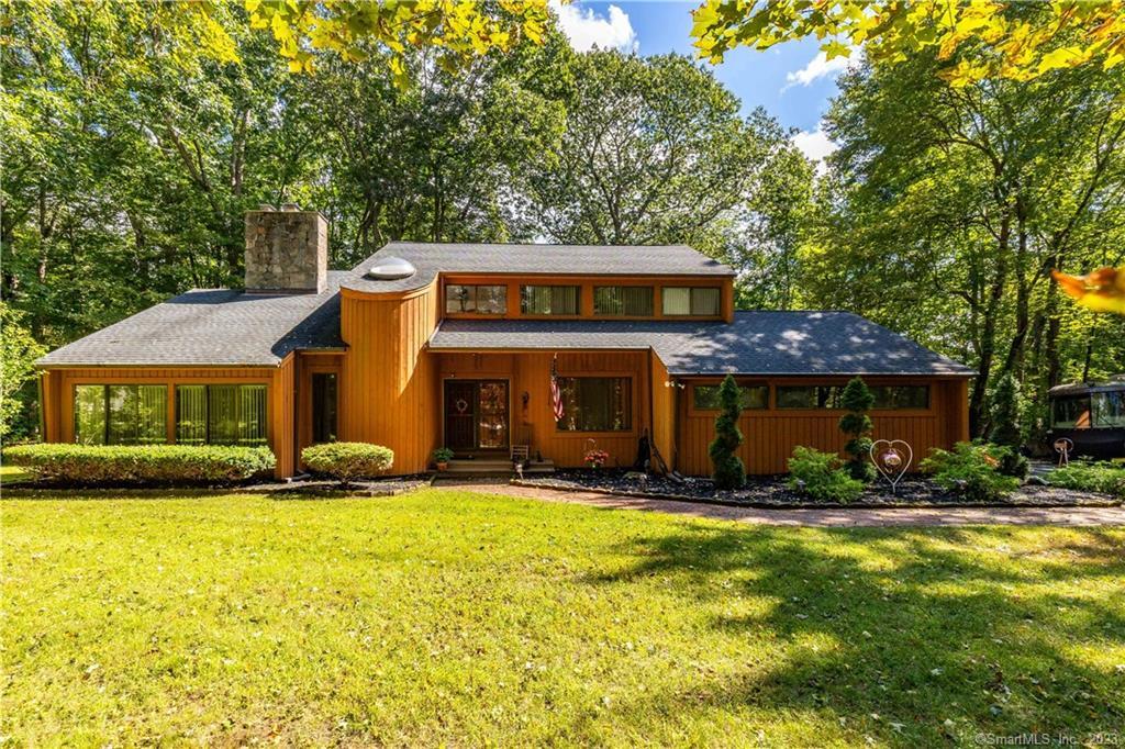 38 Bound Line Road Wolcott, CT 06716 - Photo 1 of 1 a front view of a building with garden