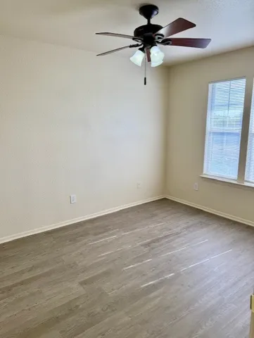 a bathroom with a double vanity sink a toilet and a bathtub