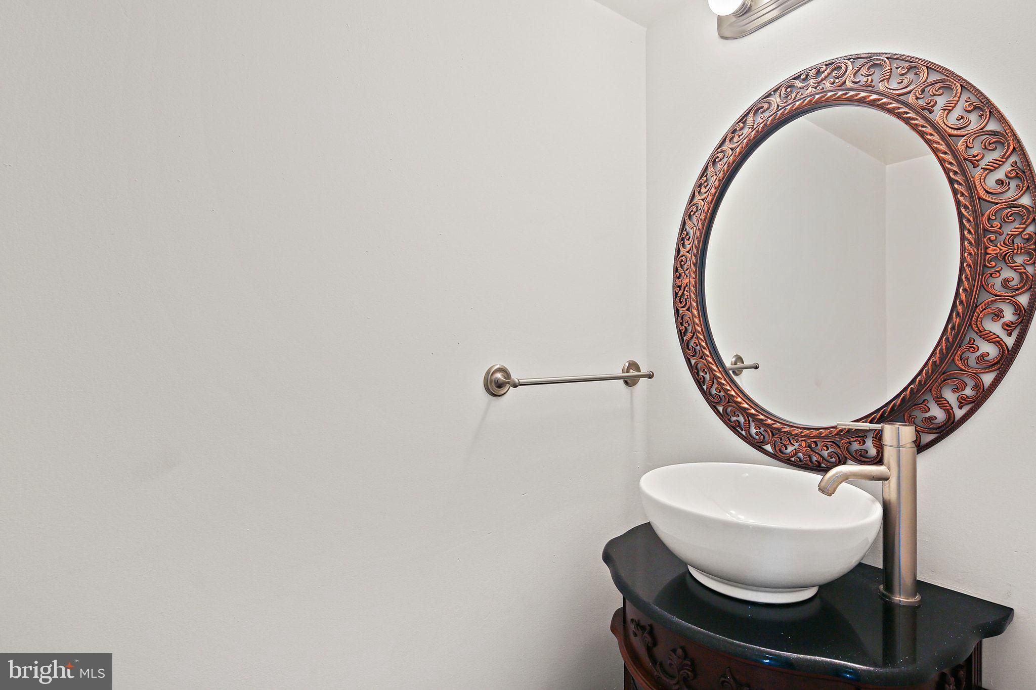 7510 Filbert Terrace Gaithersburg, MD 20879 - Photo 16 of 40 a bathroom with a toilet and a mirror