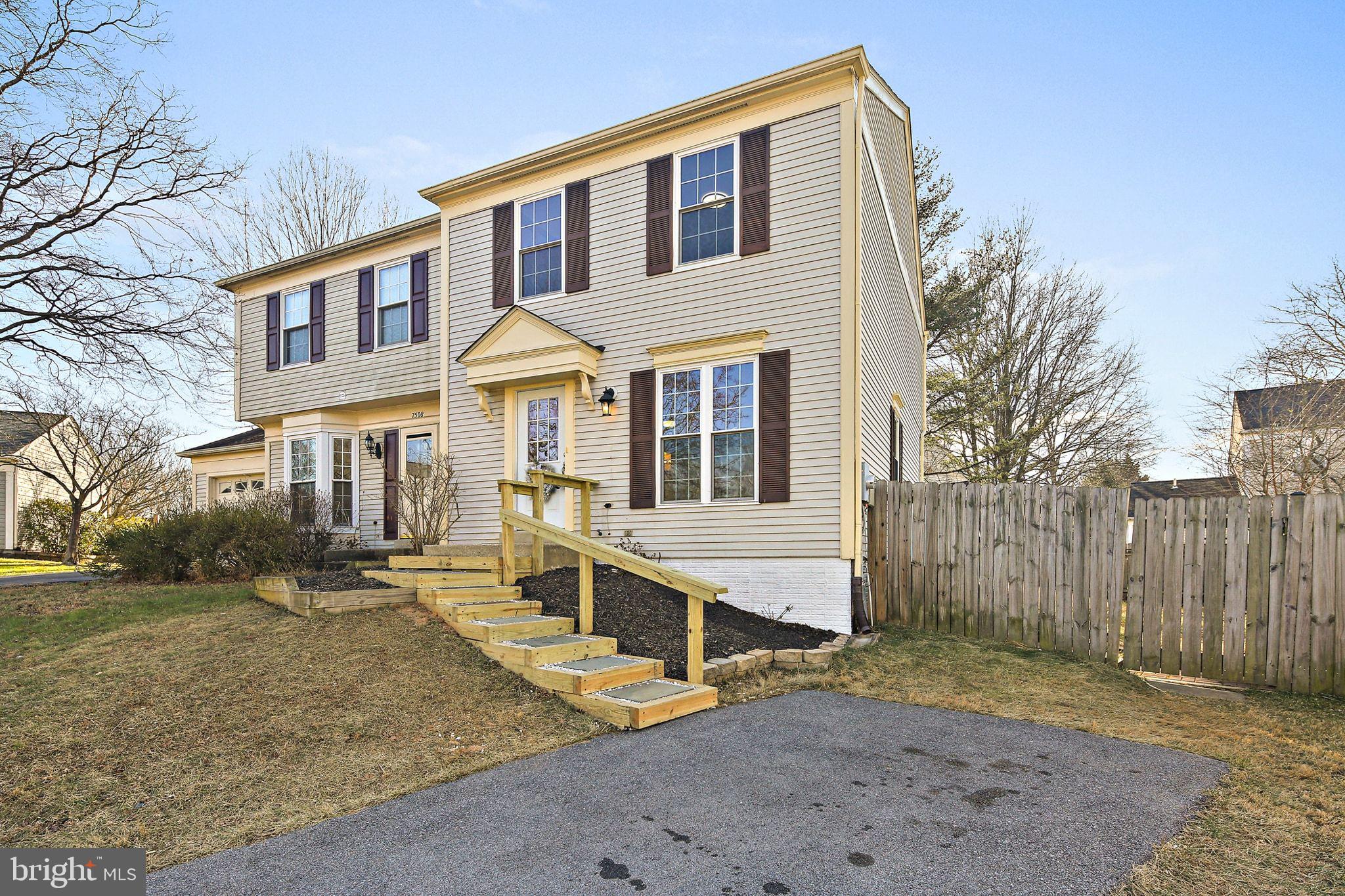 7510 Filbert Terrace Gaithersburg, MD 20879 - Photo 2 of 40 a front view of a house with a yard