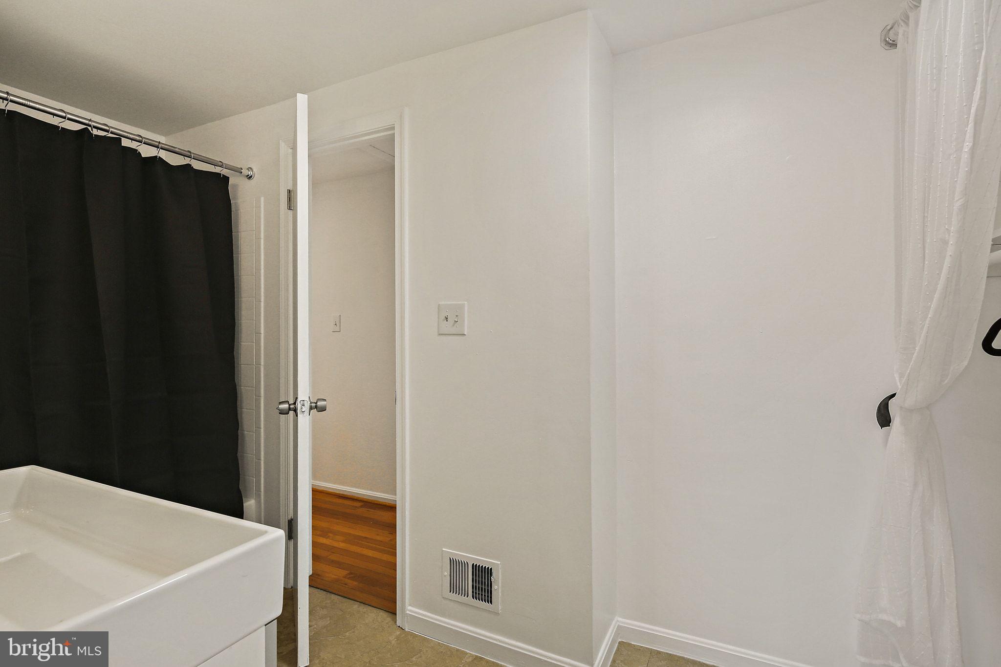 7510 Filbert Terrace Gaithersburg, MD 20879 - Photo 21 of 40 a bathroom with a shower and a sink