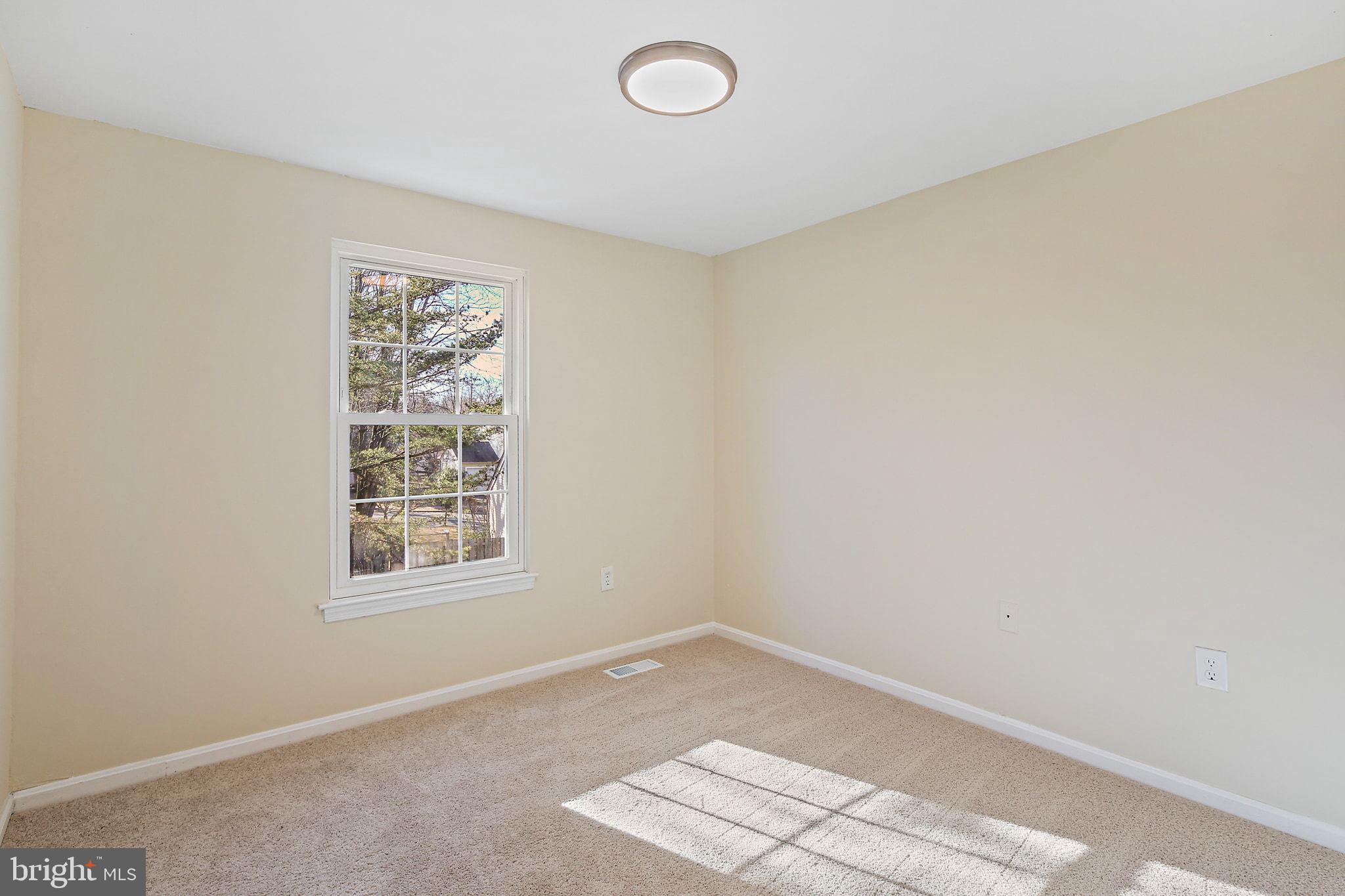 7510 Filbert Terrace Gaithersburg, MD 20879 - Photo 23 of 40 an empty room with windows