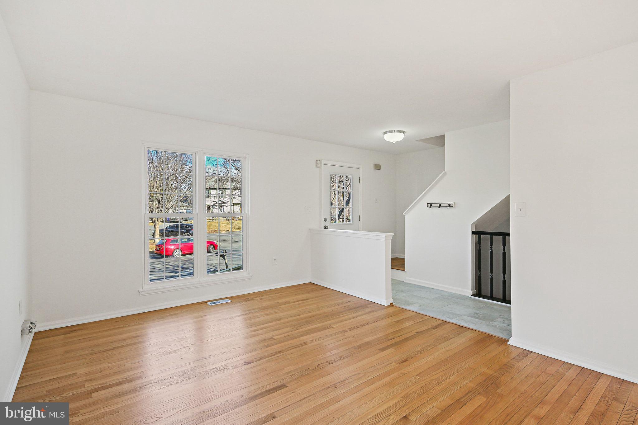 7510 Filbert Terrace Gaithersburg, MD 20879 - Photo 4 of 40 a view of empty room with wooden floor