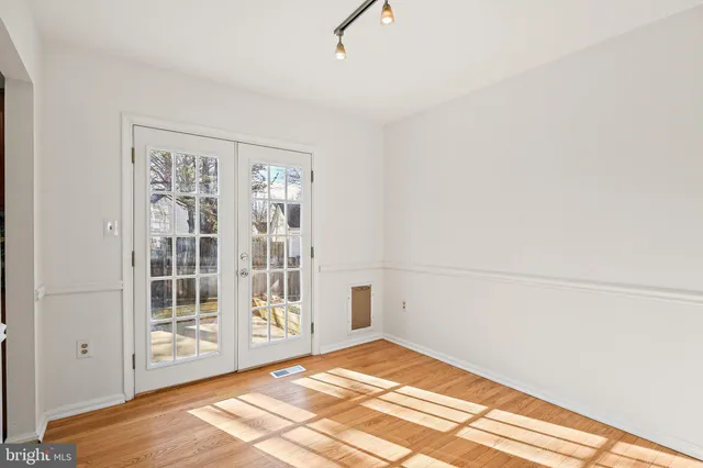 a view of an empty room with windows