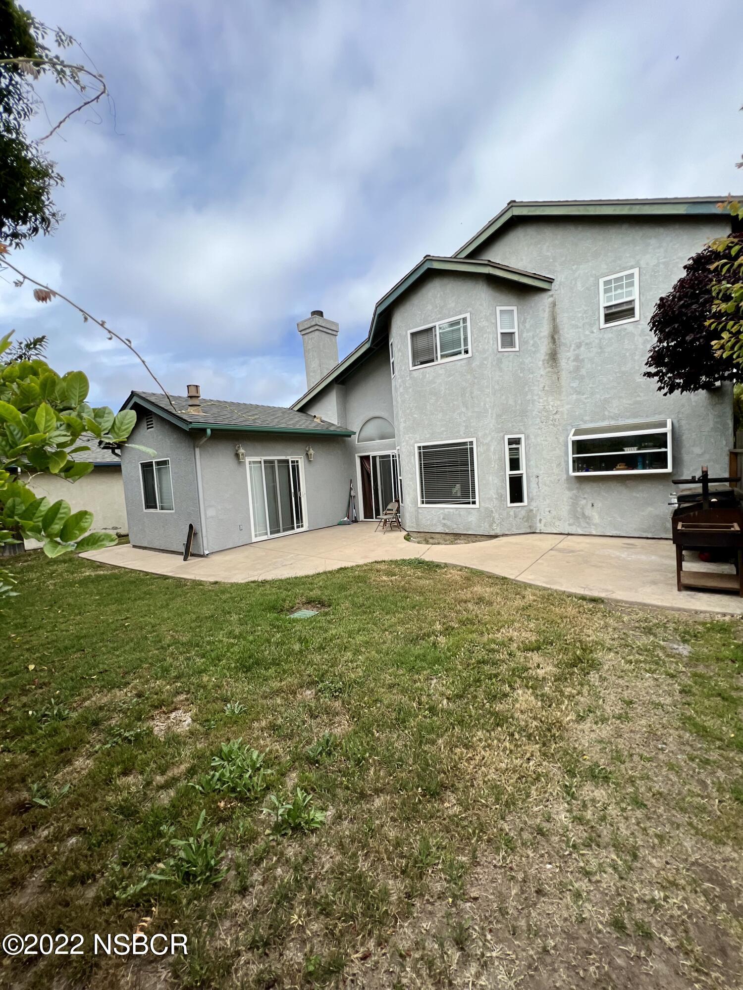 1233 Aster Lane Lompoc, CA 93436 - Photo 12 of 15 a front view of a house with a garden