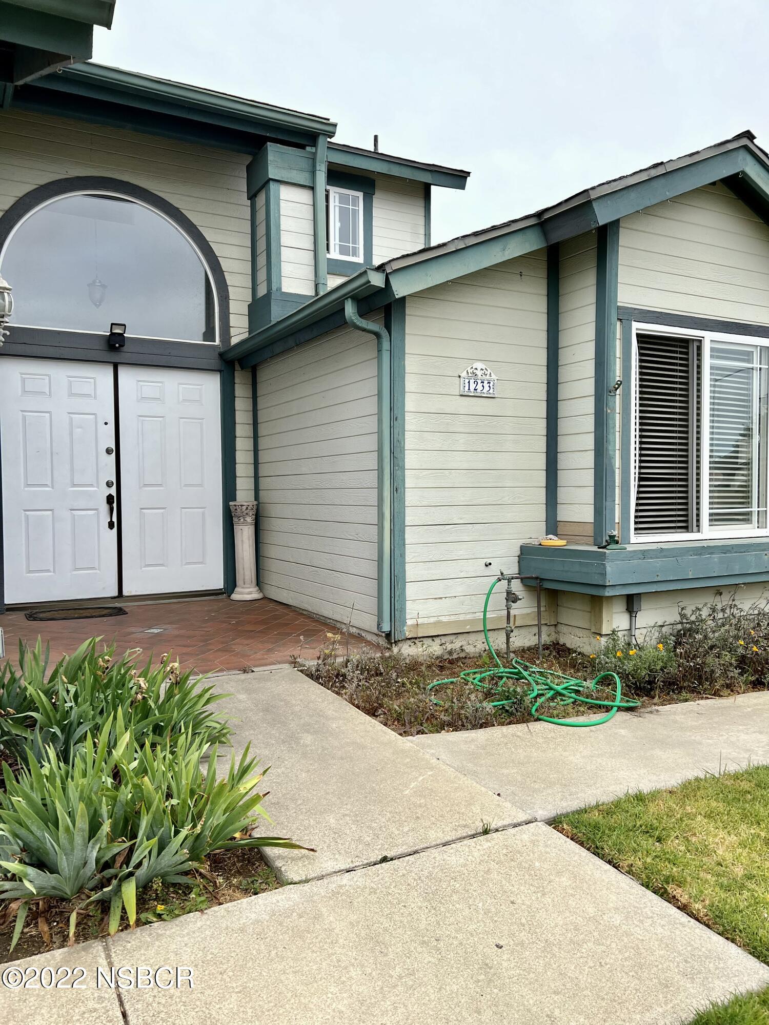 1233 Aster Lane Lompoc, CA 93436 - Photo 15 of 15 a front view of a house with garden