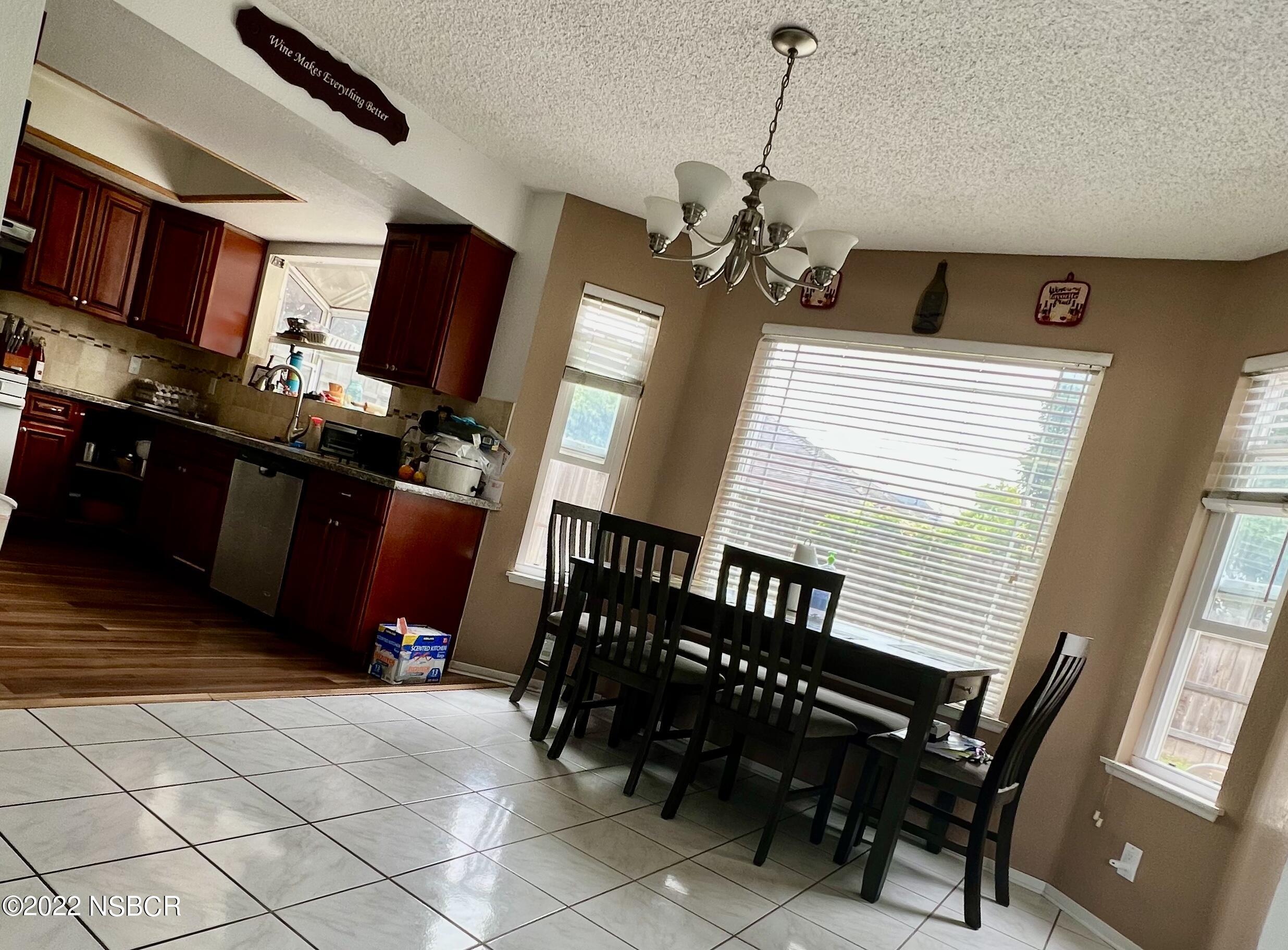1233 Aster Lane Lompoc, CA 93436 - Photo 6 of 15 a view of a livingroom with furniture and windows