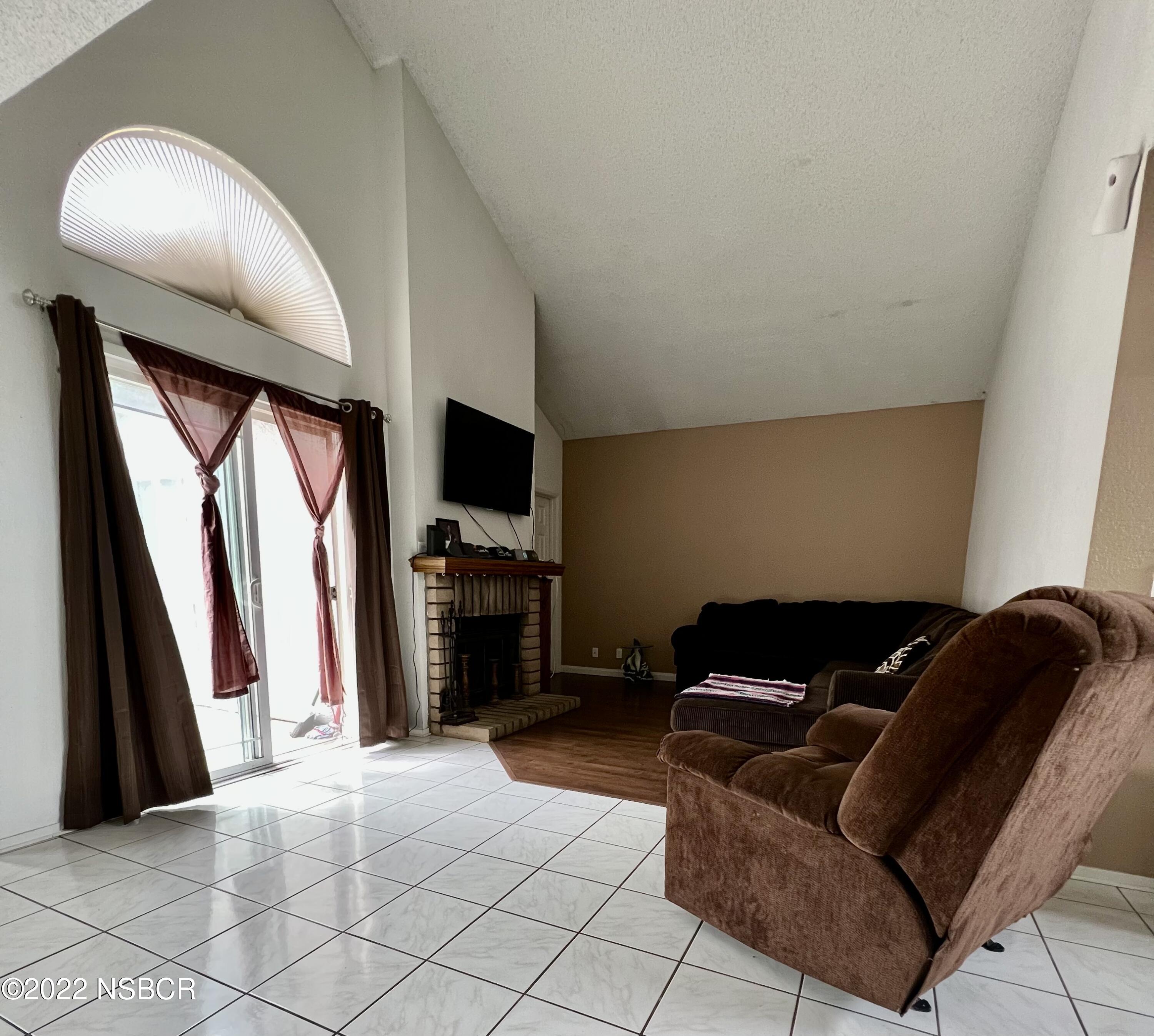 1233 Aster Lane Lompoc, CA 93436 - Photo 8 of 15 a living room with furniture and a flat screen tv