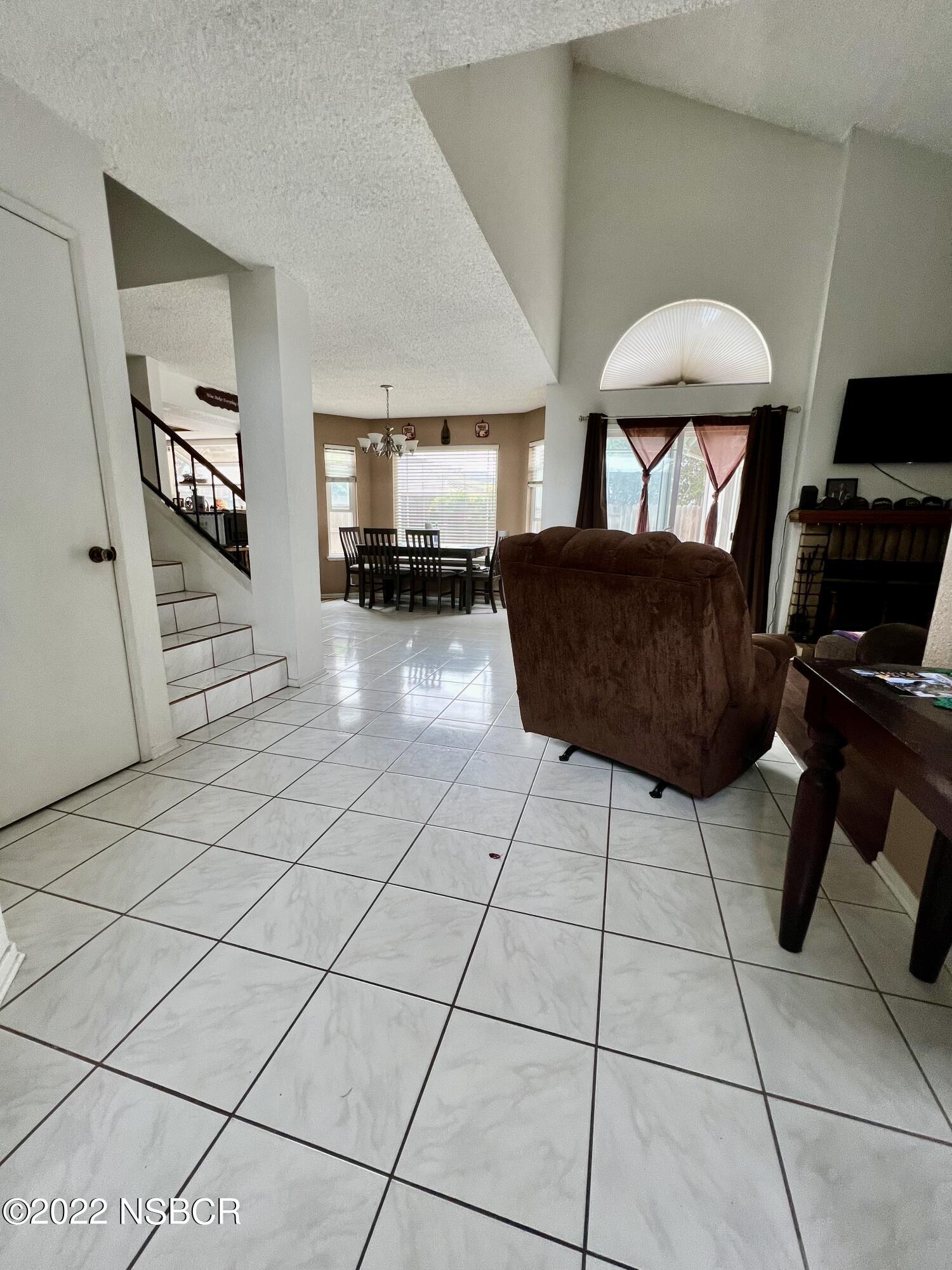 1233 Aster Lane Lompoc, CA 93436 - Photo 9 of 15 a living room with furniture and a flat screen tv