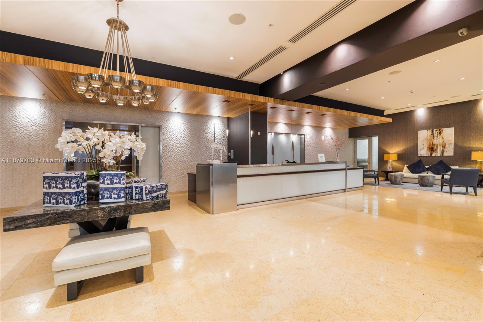 60 Southwest 13th Street, Unit 2413 Miami, FL 33130 - Photo 11 of 19 a lobby with furniture and a chandelier