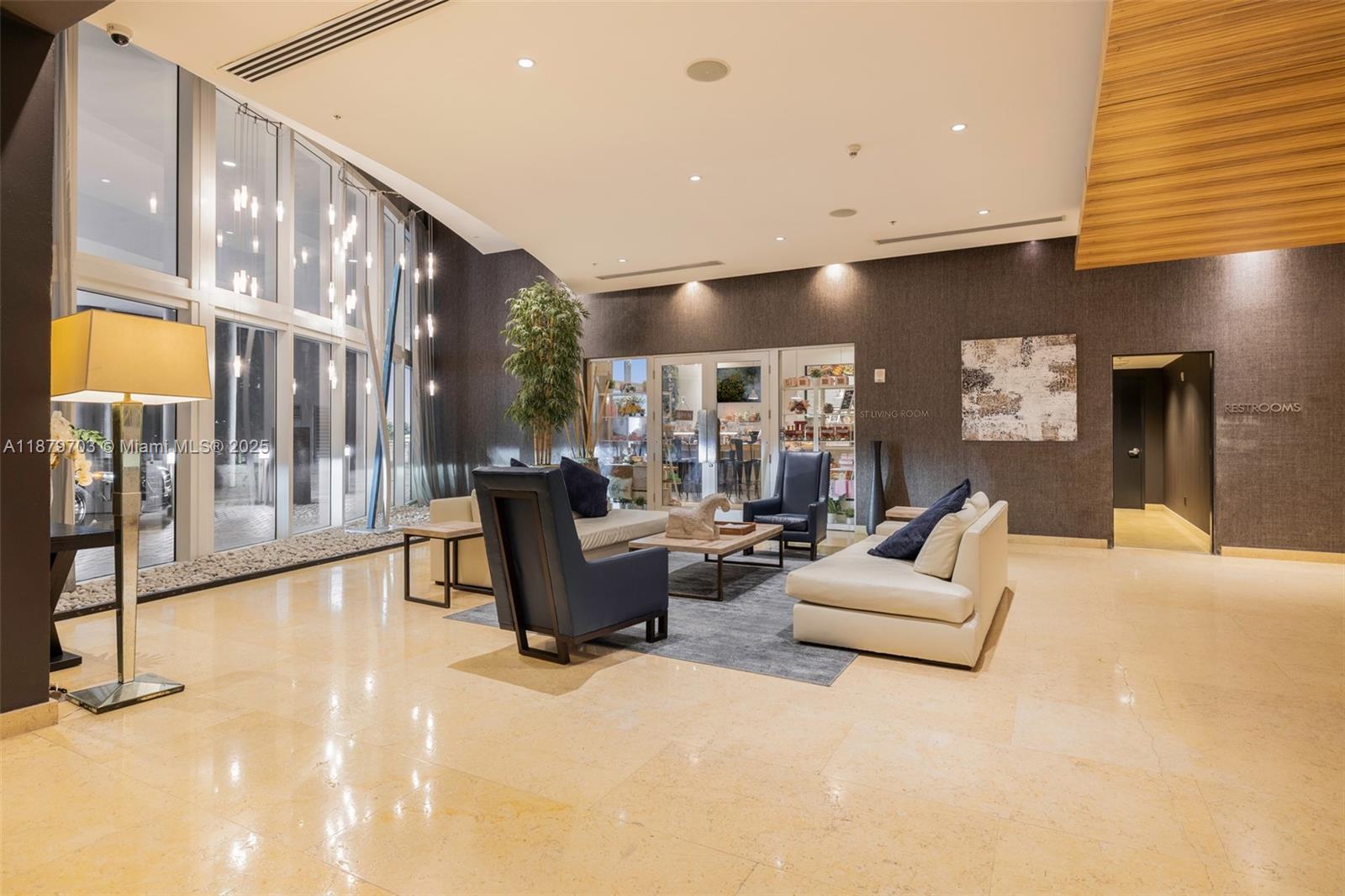 60 Southwest 13th Street, Unit 2413 Miami, FL 33130 - Photo 12 of 19 a living room with fireplace furniture and a large window