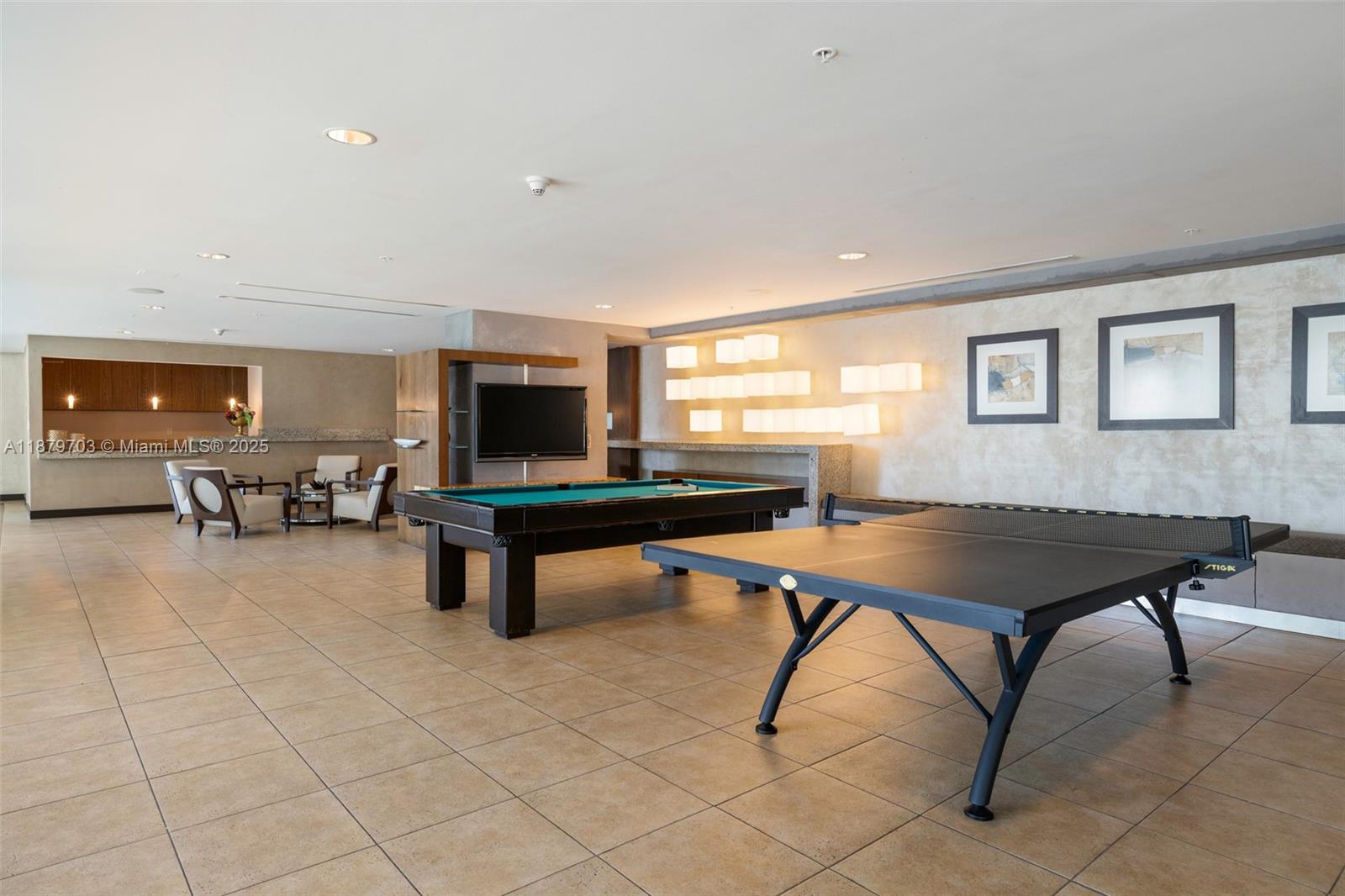 60 Southwest 13th Street, Unit 2413 Miami, FL 33130 - Photo 13 of 19 a living room with furniture pool table and a flat screen tv