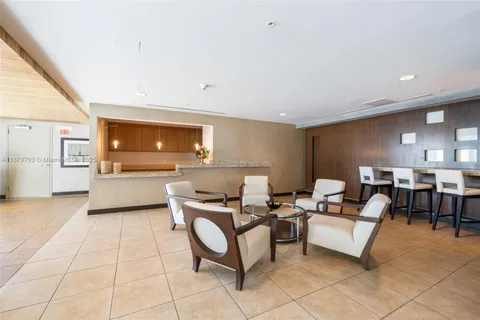 a kitchen with lots of counter space and furniture