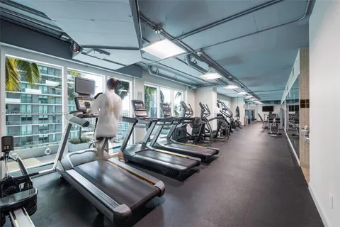 swimming pool view with a seating space