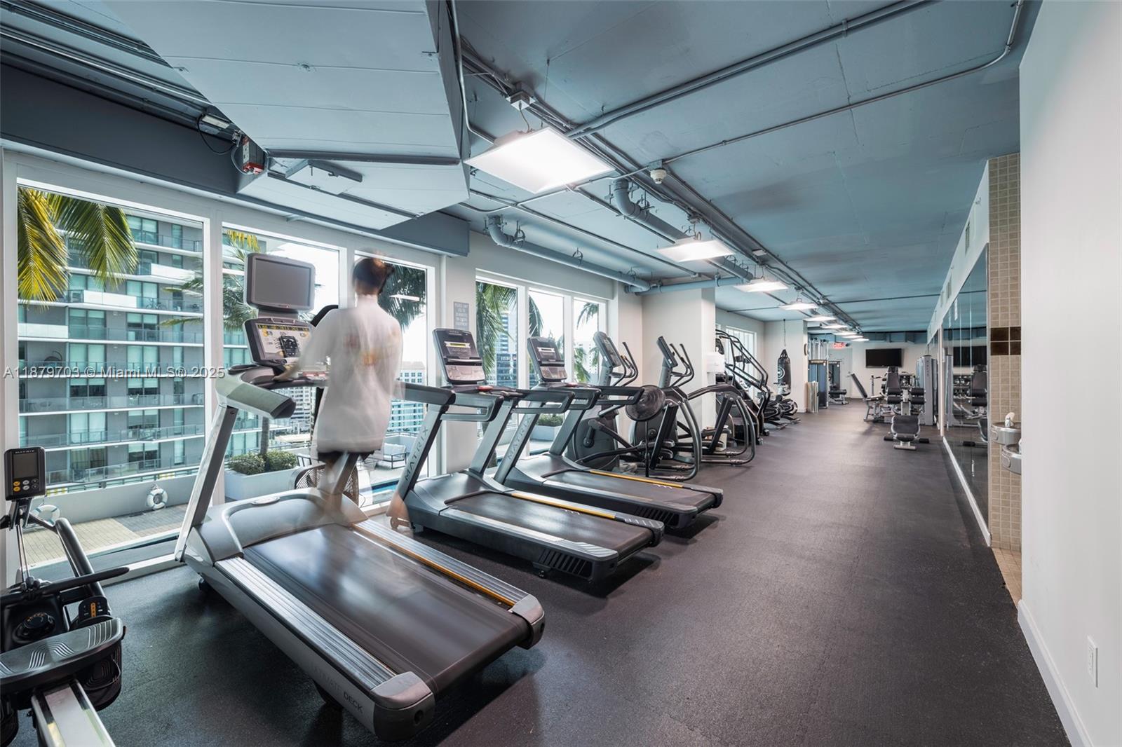 60 Southwest 13th Street, Unit 2413 Miami, FL 33130 - Photo 17 of 19 a view of a room with gym equipment