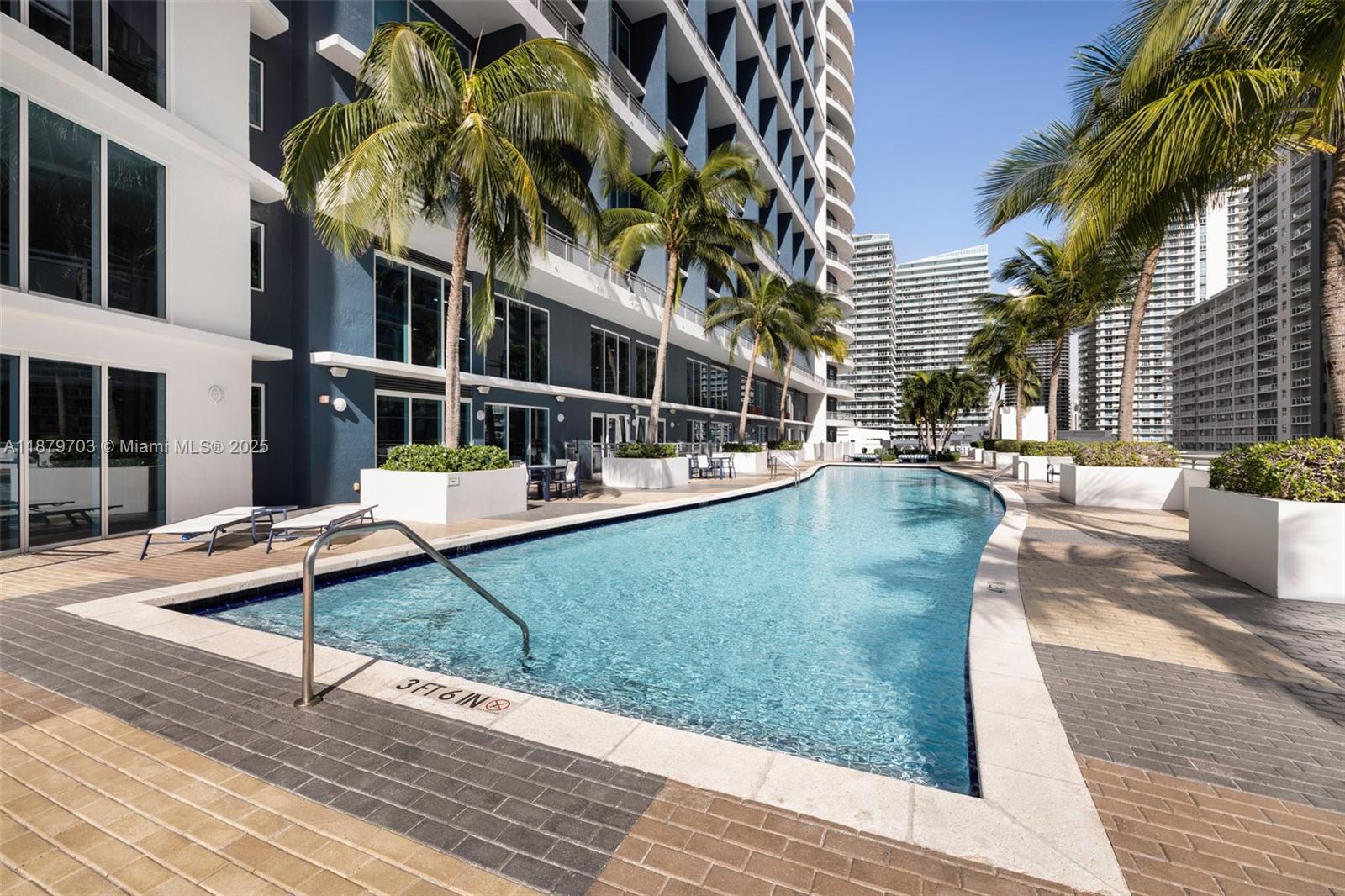 60 Southwest 13th Street, Unit 2413 Miami, FL 33130 - Photo 18 of 19 swimming pool view with a seating space