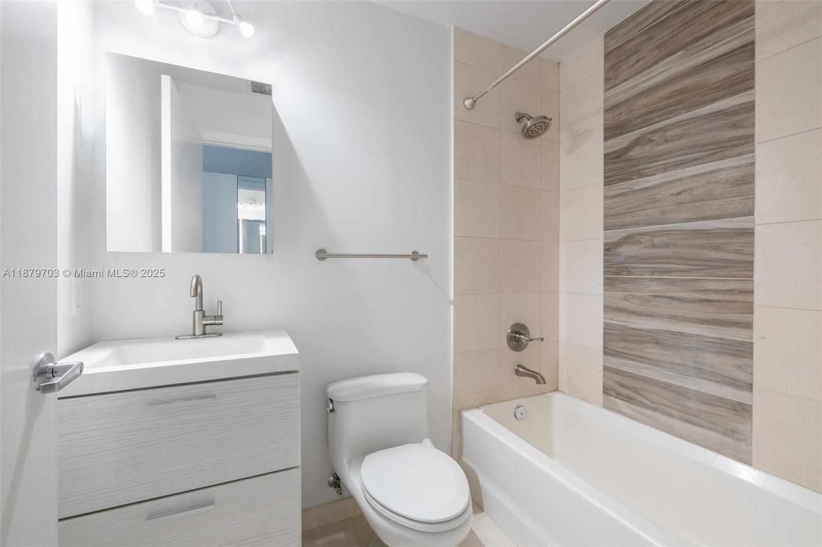 60 Southwest 13th Street, Unit 2413 Miami, FL 33130 - Photo 5 of 19 a bathroom with a toilet sink and shower