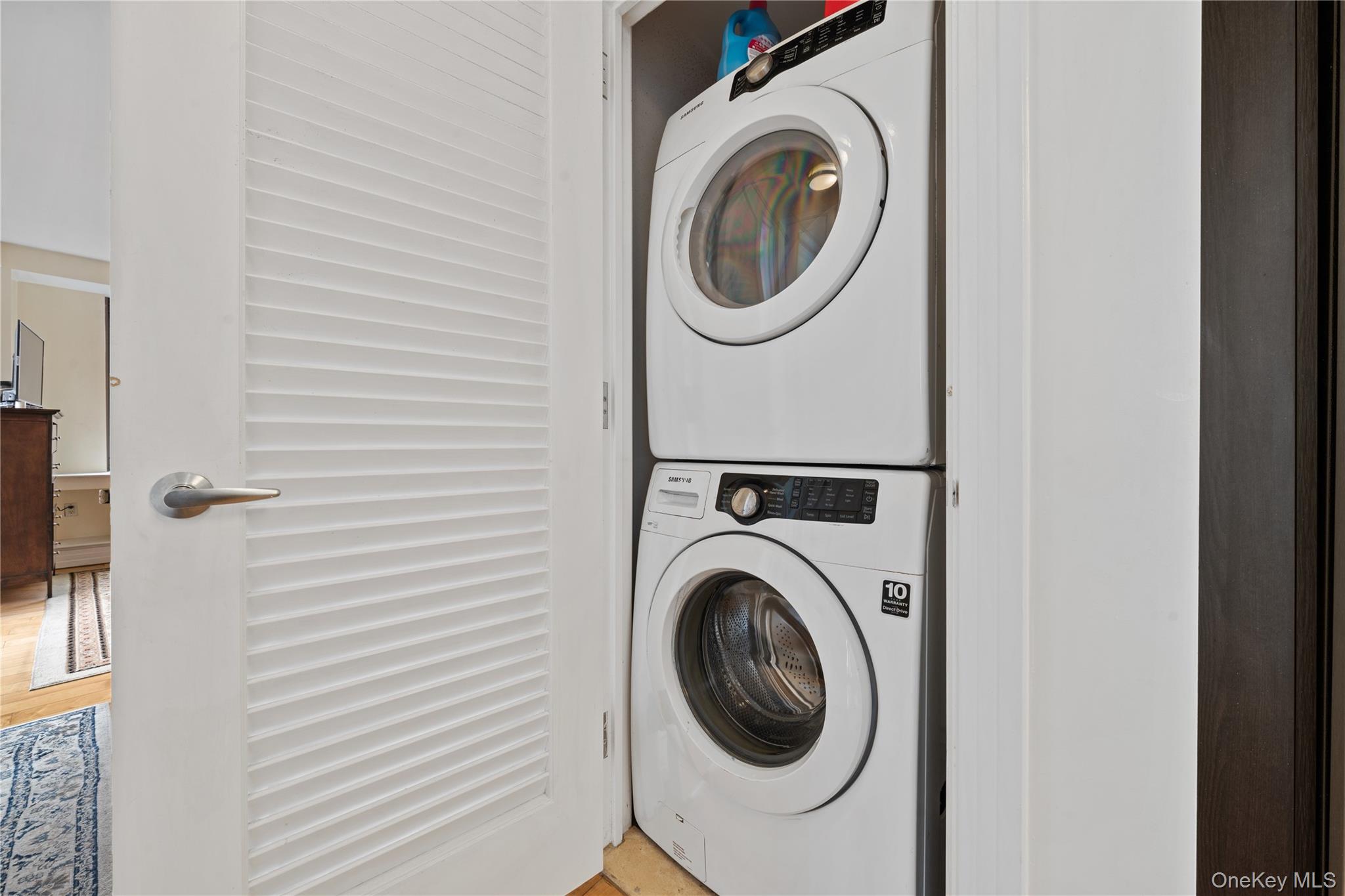 64-05 Yellowstone Boulevard, Unit PH 509 Queens, NY 11375 - Photo 15 of 28 a utility room with dryer and washer