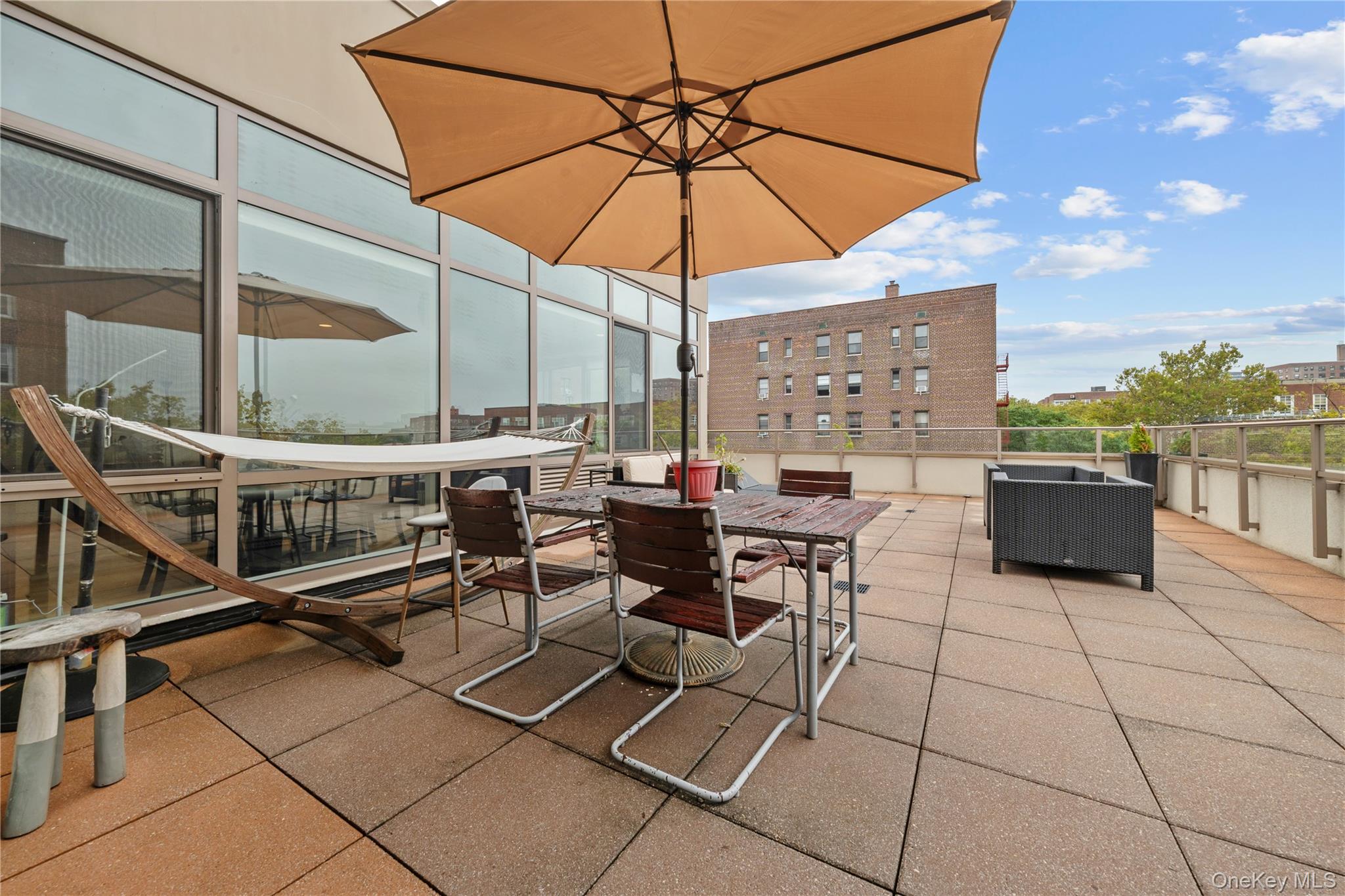 64-05 Yellowstone Boulevard, Unit PH 509 Queens, NY 11375 - Photo 18 of 28 a outdoor space with lots of chairs