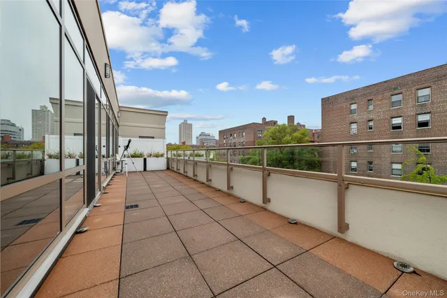 a hallway with a floor to ceiling window next to a yard