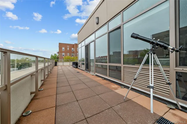 a view of a balcony with chairs