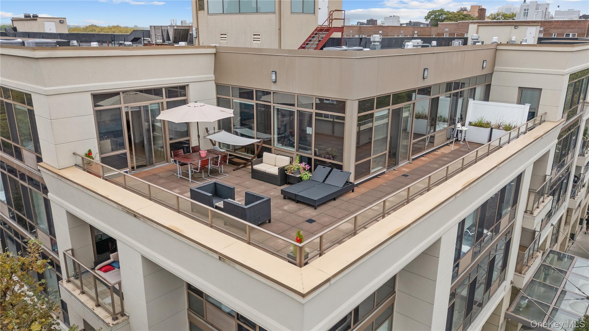 64-05 Yellowstone Boulevard, Unit PH 509 Queens, NY 11375 - Photo 22 of 28 a view of a balcony with chairs