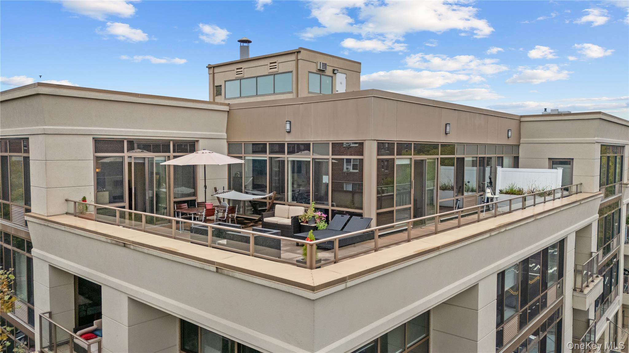 64-05 Yellowstone Boulevard, Unit PH 509 Queens, NY 11375 - Photo 23 of 28 a view of a large building with a large windows