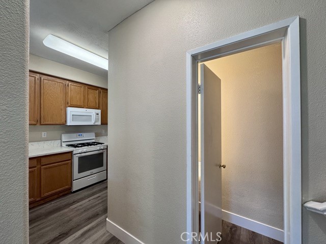 30455 Buccaneer Bay, Unit A Murrieta, CA 92563 - Photo 11 of 43 a kitchen with a stove and a refrigerator