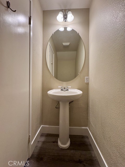 30455 Buccaneer Bay, Unit A Murrieta, CA 92563 - Photo 12 of 43 a bathroom with a sink and mirror