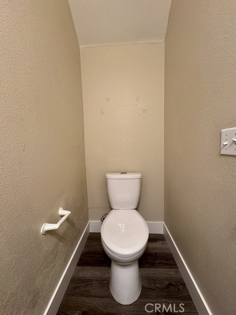 30455 Buccaneer Bay, Unit A Murrieta, CA 92563 - Photo 13 of 43 a white toilet sitting in a bathroom