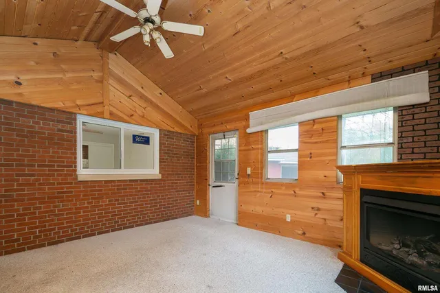 a view of an empty room with a fireplace