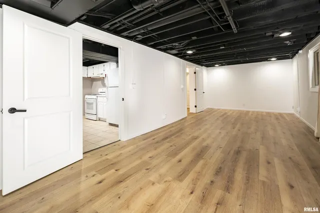 a kitchen with cabinets and white appliances