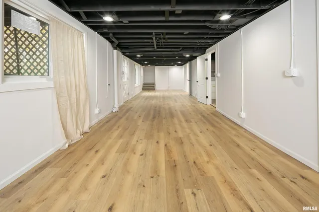 a view of room with wooden floor