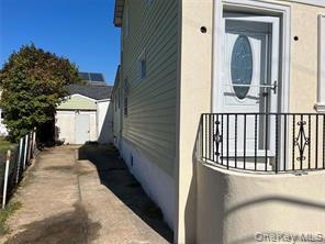 90 Murray Hill Street Elmont, NY 11003 - Photo 5 of 6 a view of a house with a small yard