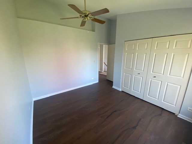 209 North Southport Road Mundelein, IL 60060 - Photo 13 of 18 an empty room with wooden floor fan and windows